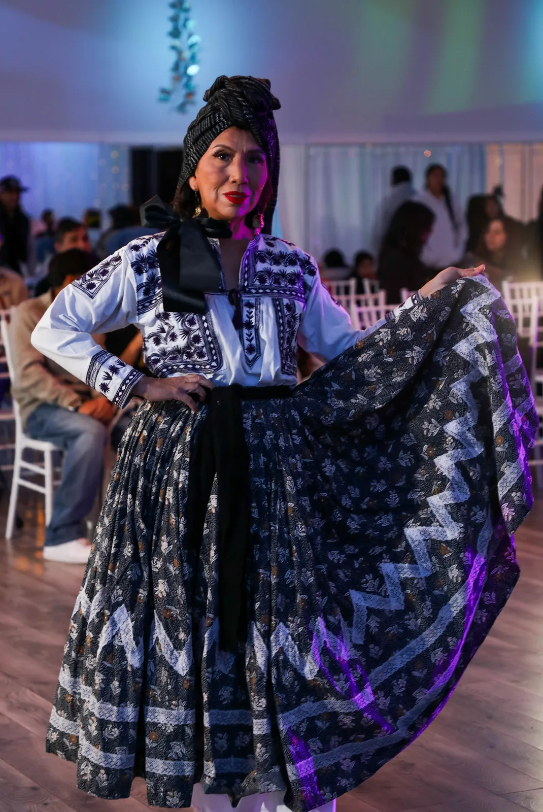 Black-and-white embroidered blouse and patterned skirt from the script’s mourning presentation at Oaxaca en Utah’s Fashion Show 2025