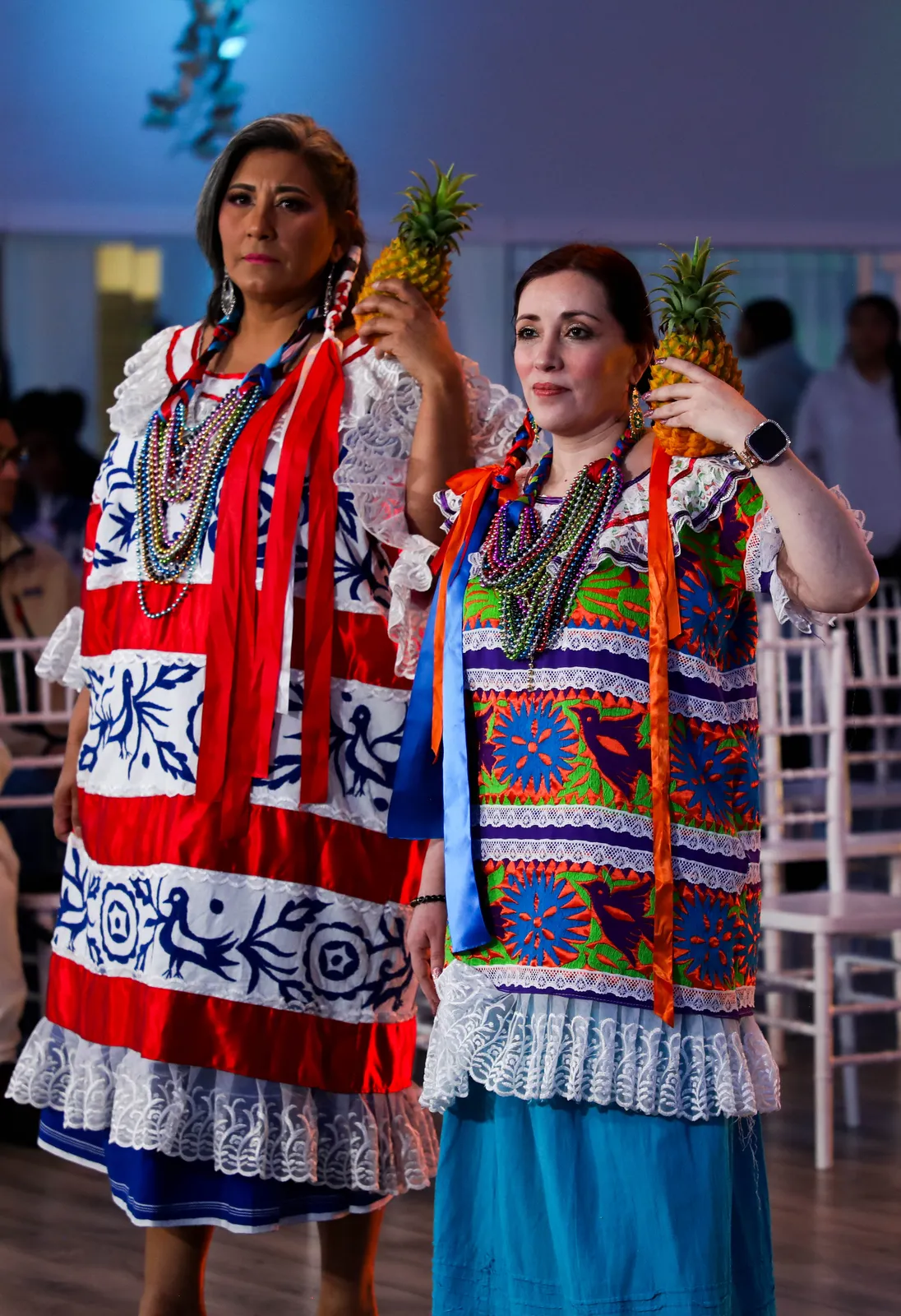 Huipiles with broad horizontal decorative bands in the 2025 Papaloapan presentation at Oaxaca en Utah’s Fashion Show 2025