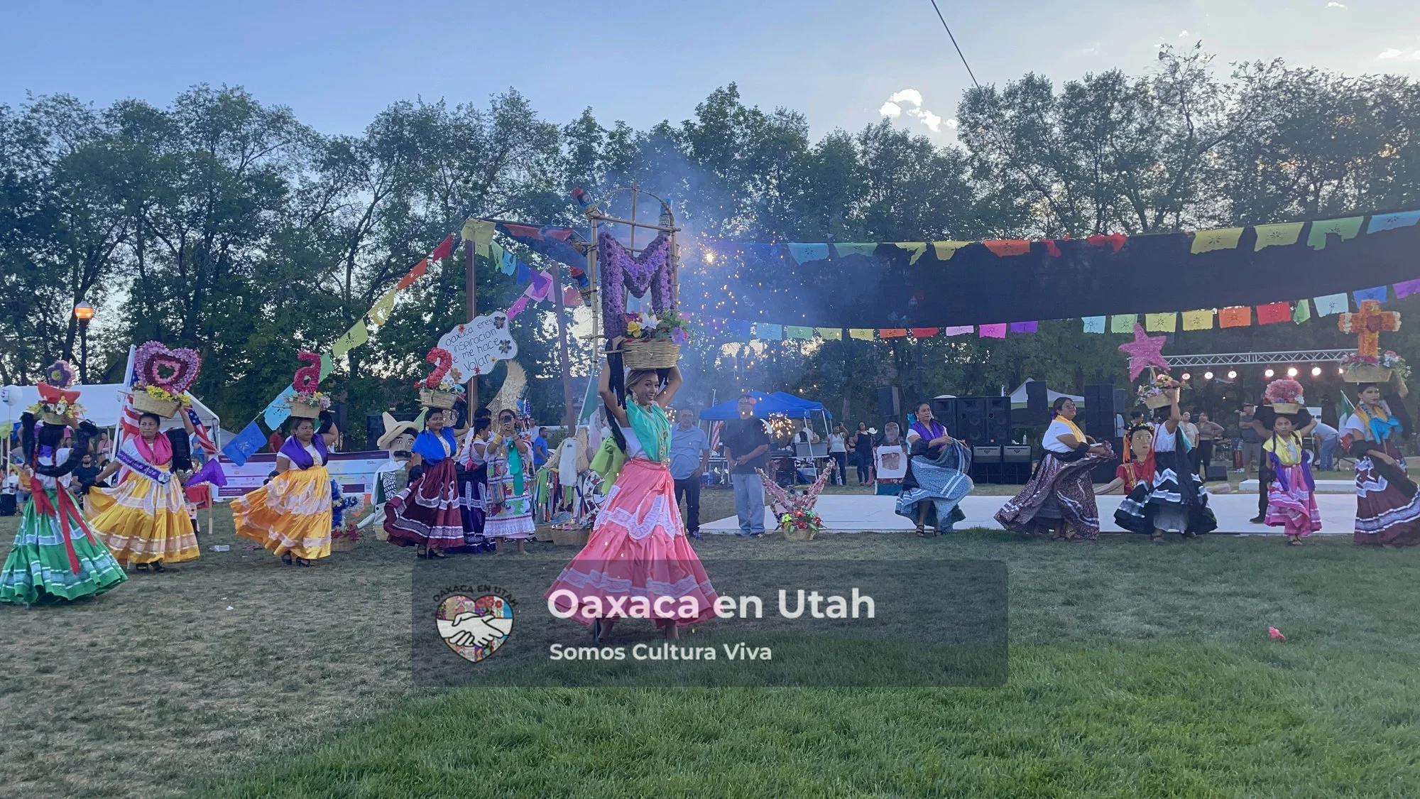 Chinas Oaxaqueñas carry floral baskets during La Guelaguetza 2026 in Kaysville