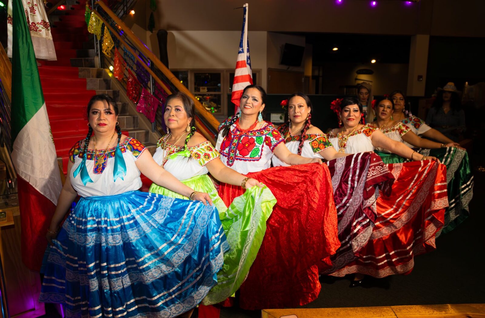 Oaxaca en Utah participants in embroidered blouses and colorful skirts at the 2026 Fashion Show