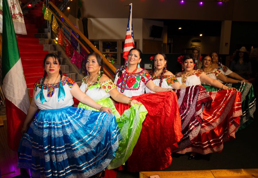 Oaxaca en Utah participants in embroidered blouses and colorful skirts at the 2026 Fashion Show